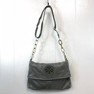 Grey distressed Tory Burch crossbody bag.